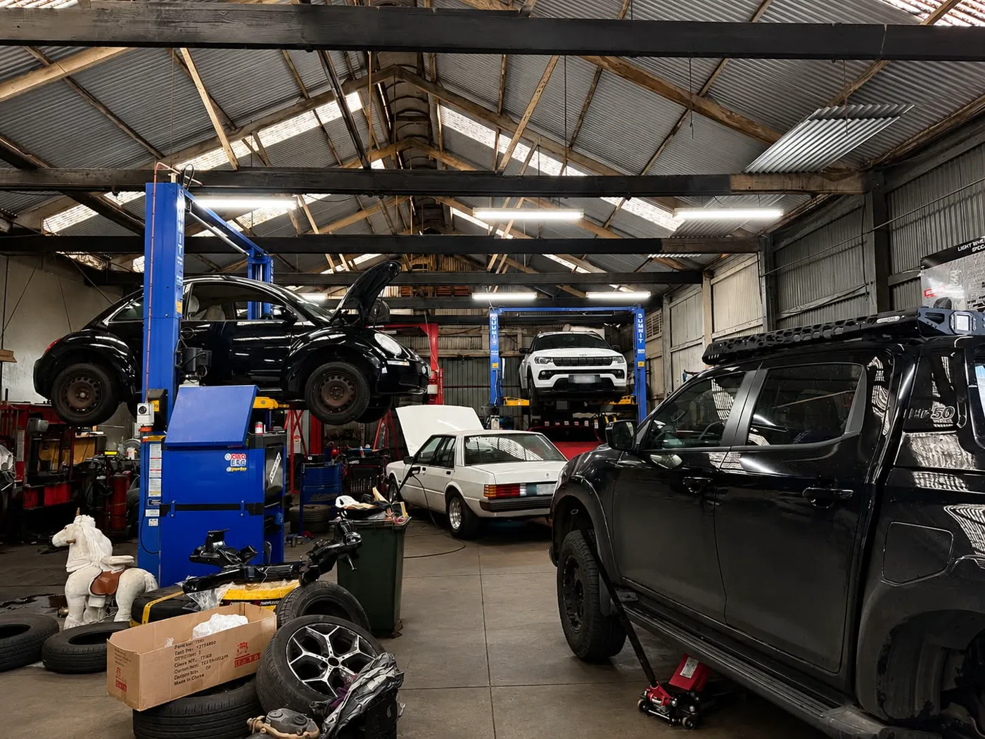 A wide view of the Light Wheel Alignment workshop interior at 60 Byron Place