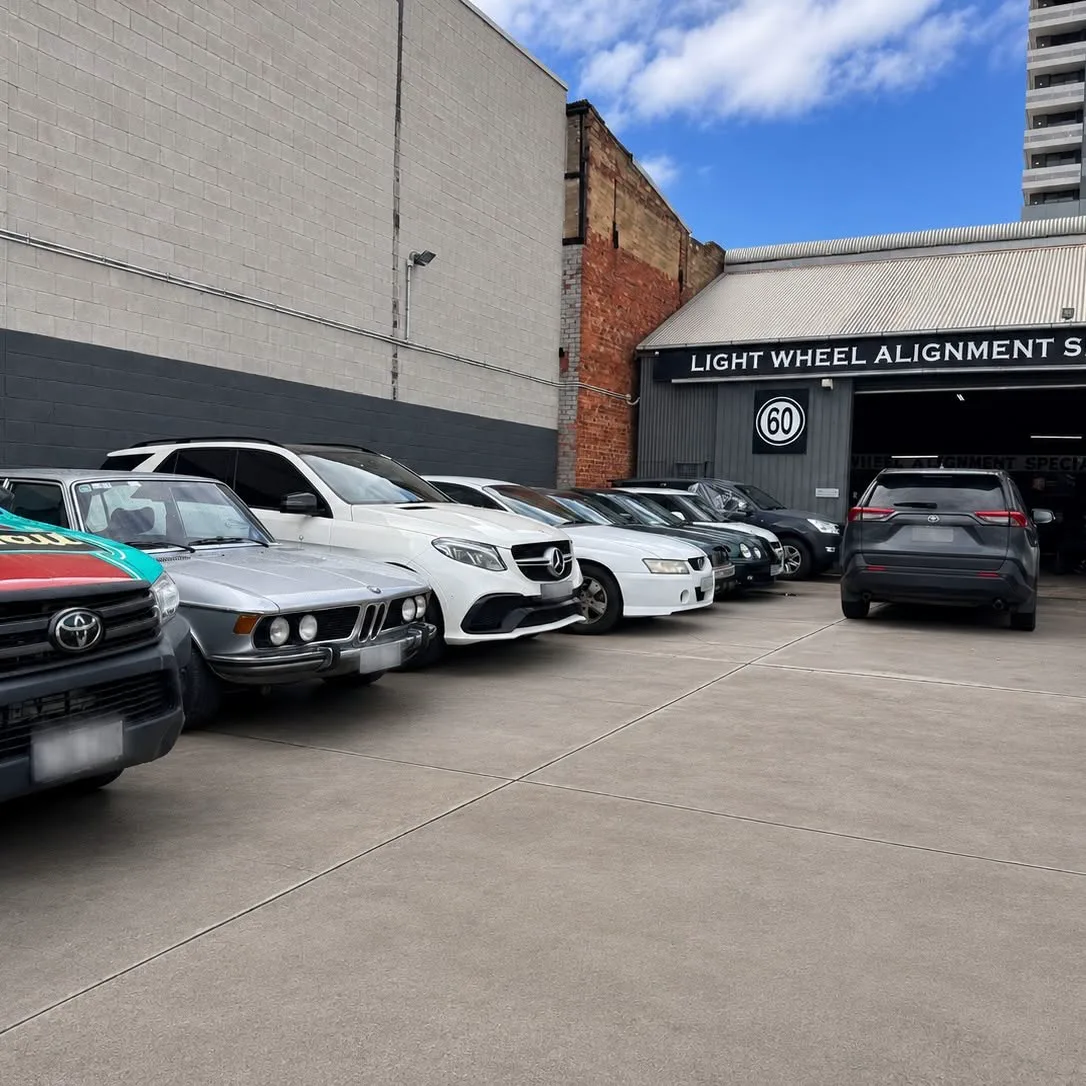 Customer cars parked along the workshop frontage on Byron Place in the Adelaide CBD